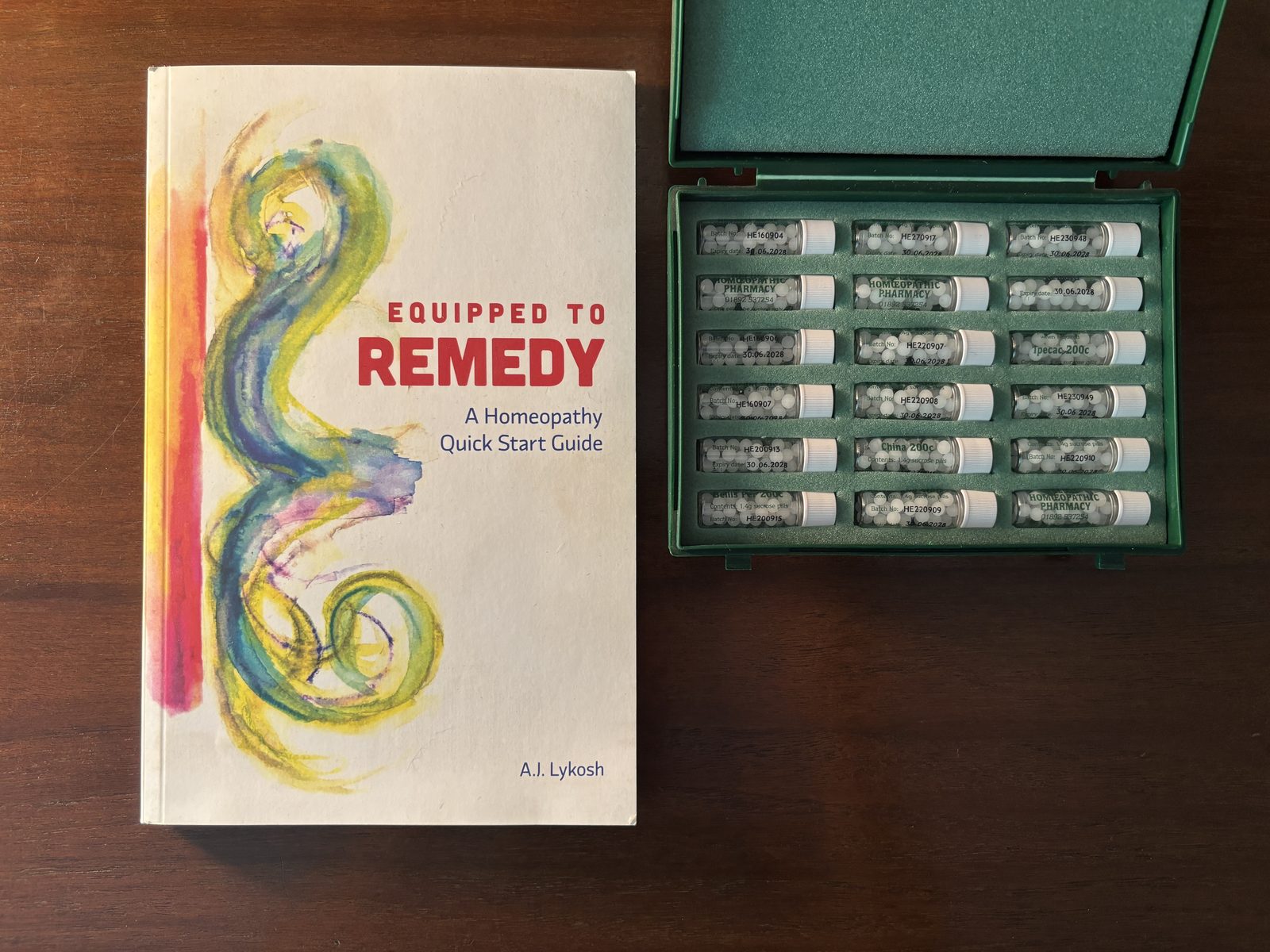 The Equipped to Remedy book beside its companion remedy kit
